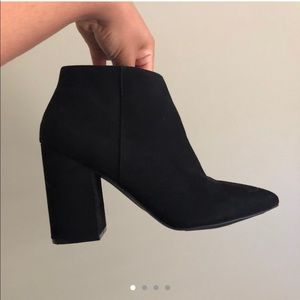 Heeled black booties